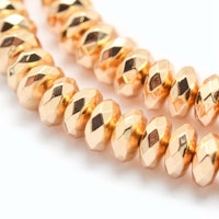 Ljust guldfärgad hematit facetterade rondeller 6x3 mm, 1 sträng