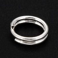 Silverfärgat rostfritt stål dubbelringar 6 mm, ca 100 st