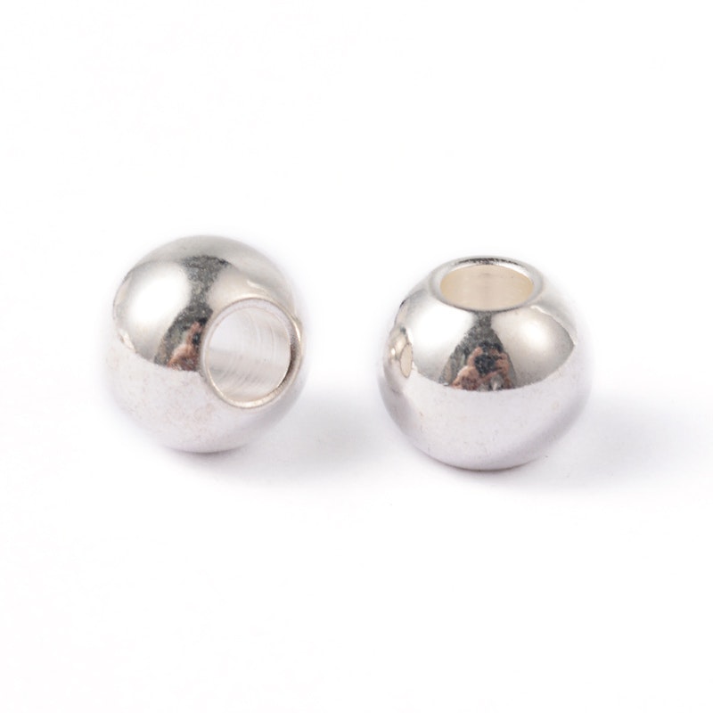 Silverfärgat rostfritt stål pärlor 3x2 mm, ca 100 st