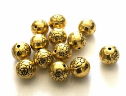 Antikt guldfärgade pärlor 8 mm med blomma, ca 100 st