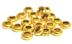Antikt guldfärgade mellandelar breda ringar 7 mm, ca 50 st