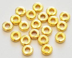 Guldfärgade mellandelar raka och runda 6 mm, ca 1000 st