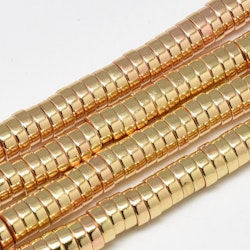 Ljust guldfärgad hematit rondeller 6x2 mm, 1 sträng