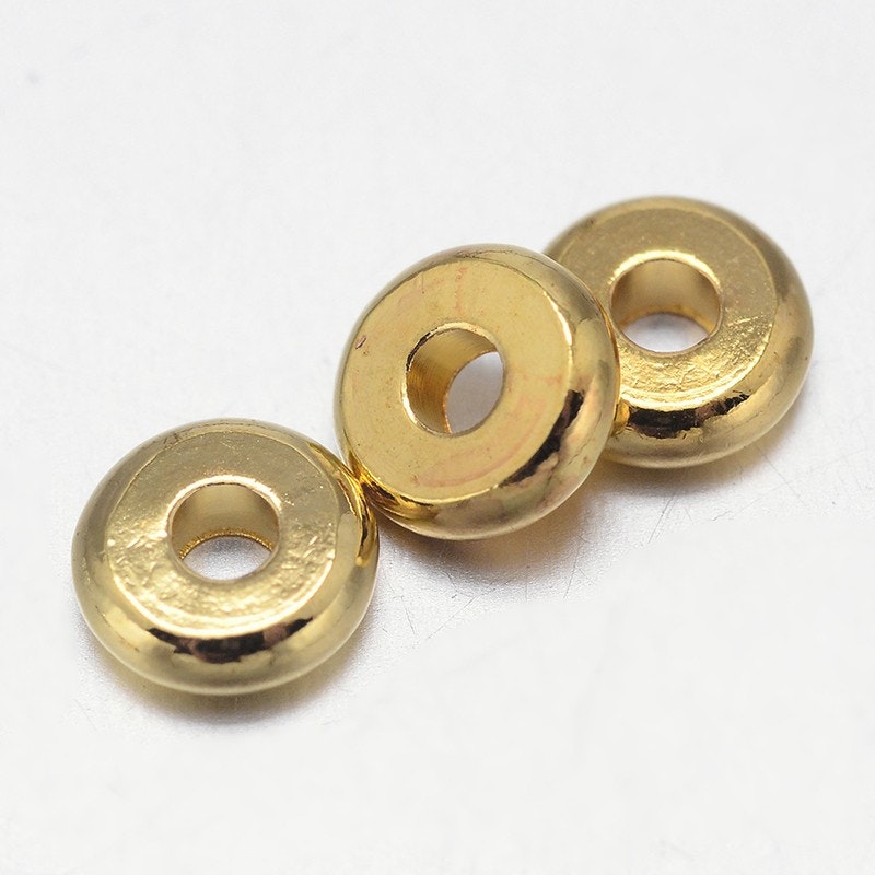 Guldfärgade rondeller 5 mm, ca 50 st