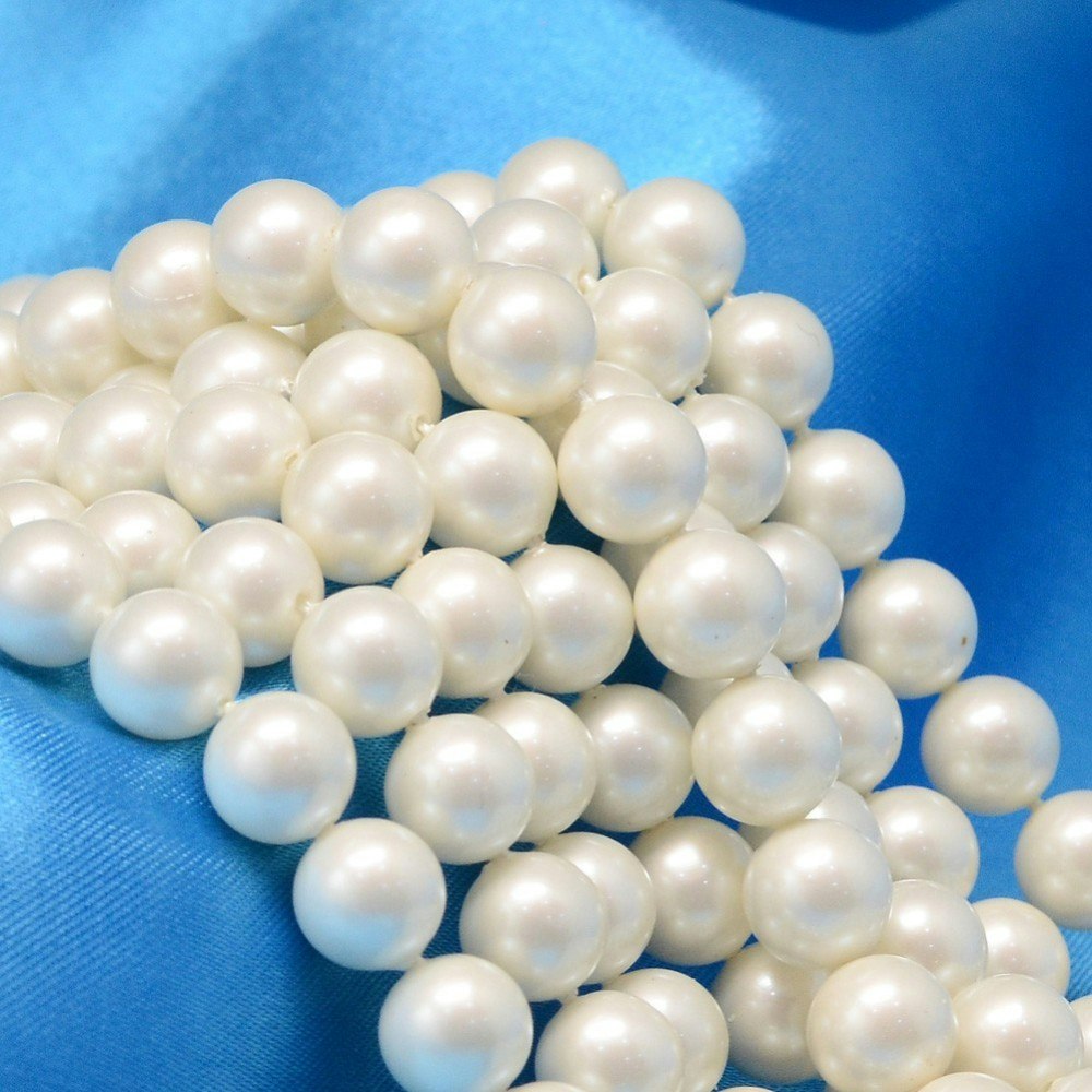 Snäckskalspärlor creme 8 mm, 1 sträng