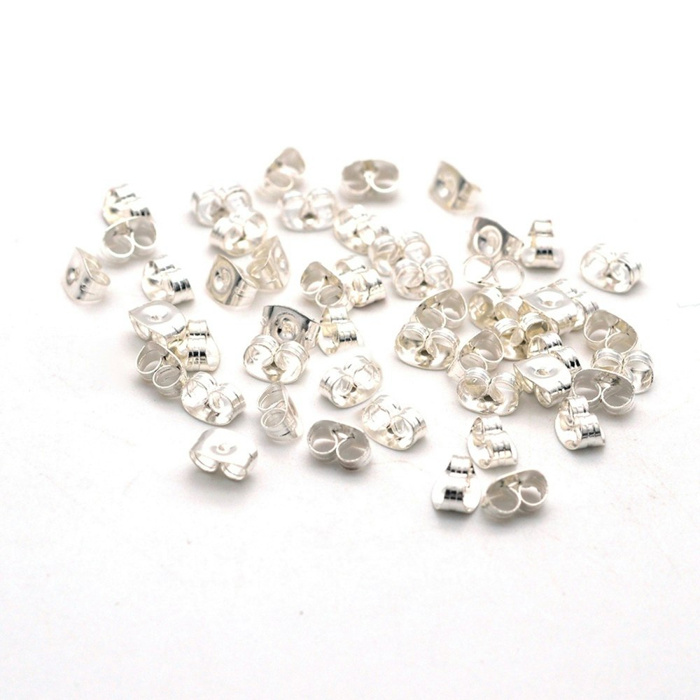 Silverfärgat rostfritt stål små ear nuts, ca 450-500 st