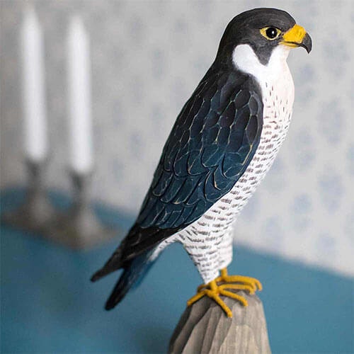 Hand-carved peregrine falcon in wood