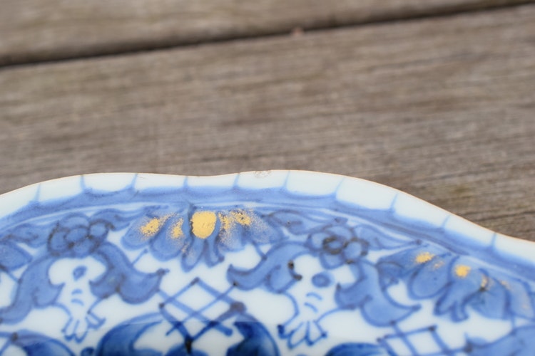 A antique chinese blue and white dish with molded rim period of Qianlong