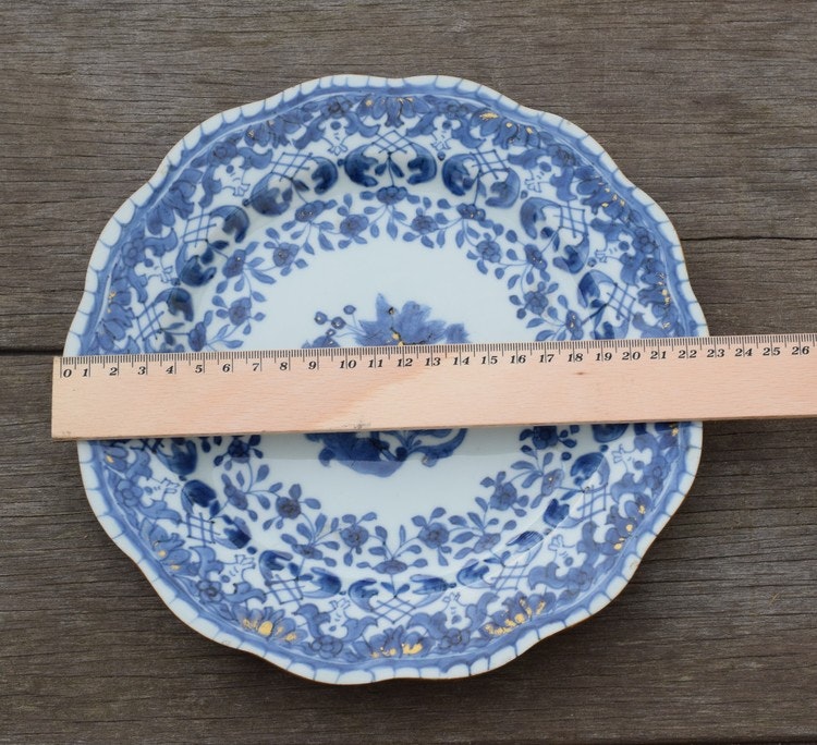 A antique chinese blue and white dish with molded rim period of Qianlong