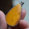 Antique natural baltic amber pendant egg yolk handcarved floral design 1960's