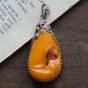 Antique natural baltic amber pendant egg yolk handcarved floral design 1960's