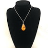 Antique natural baltic amber pendant egg yolk handcarved floral design 1960's