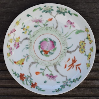 Antique chinese famille rose plate decorated with flowers, peach and bat