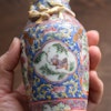 An antique canton famille rose vase with gold gilded dragons