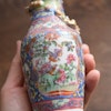 An antique canton famille rose vase with gold gilded dragons