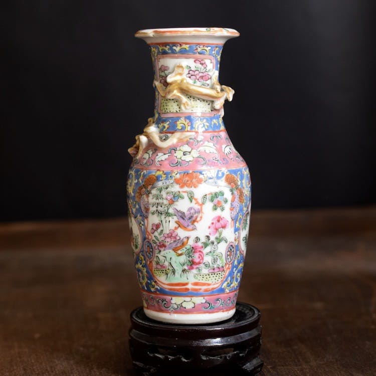An antique canton famille rose vase with gold gilded dragons