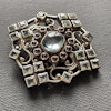 Vintage brooch in 925 sterling silver inlaid with blue transparent topaz 29g