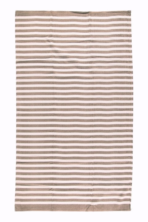 Java stripe ett badlakan i brun och vitrandig frotté i 100% bomull från Noble house, i mått 90 x 150 cm.