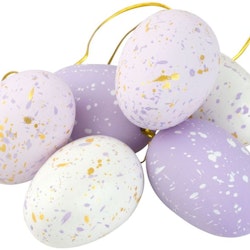Stänk ägg i ett sexpack från Cult design att dekorera påskriset med. Färg: Lila och vita stänkmålade ägg.
