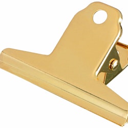 Pappersklämma i guldfärgad metall från Hedlundgruppen, mått bredd 7 cm, höjd 5 cm.