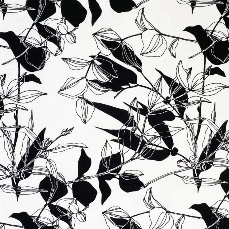 Zen ett gardintyg/inredningstyg på metervara med ett svart bladmönster på vit botten från Redlunds textil.