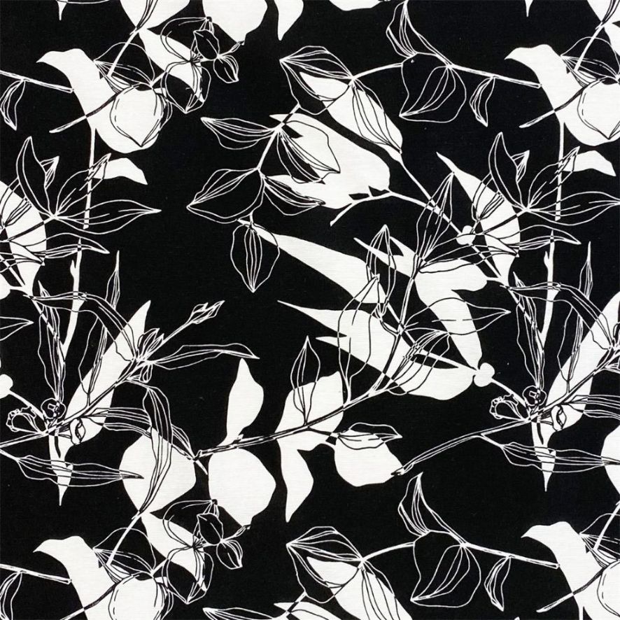 Zen ett gardintyg/inredningstyg på metervara med ett svart och vitt bladmönster från Redlunds textil.