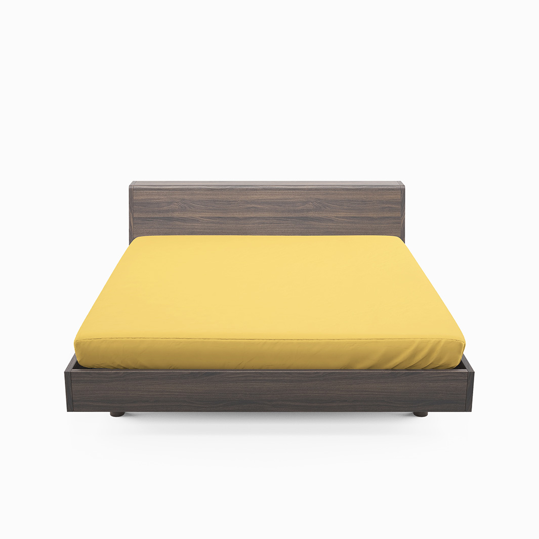Solid color ett gult dra på lakan i bomull som även går att använda som sängtopp till madrasser, från Indusia design.