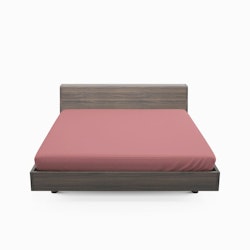 Solid color satin ett rosa dra på lakan i bomullssatin som även går att använda som sängtopp till madrasser, från Indusia design.