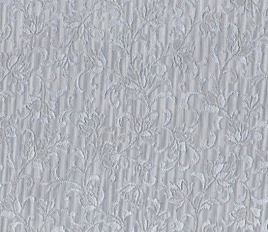 Brodyr en grå/silverfärgad vaxduk med ett ¨broderat¨ mönster på metervara i bredd 140 cm