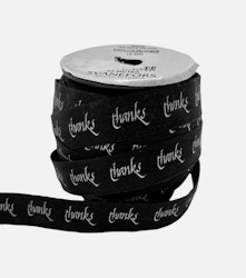 Bomullsband i svart med texten thanks i bredd 15 mm från Svanefors