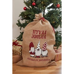 Hyvää joulua en tomtesäck med finsk tex i jute med ett juligt tryck i rött, vitt och grått från Noble house, mått 60 x 90 cm