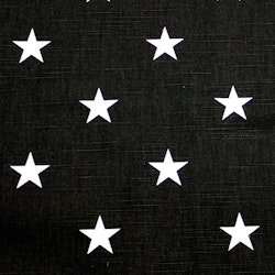 Stjärna en svart textilvaxduk med vita stjärnor på metervara i bredd 138 cm från Redlunds textil