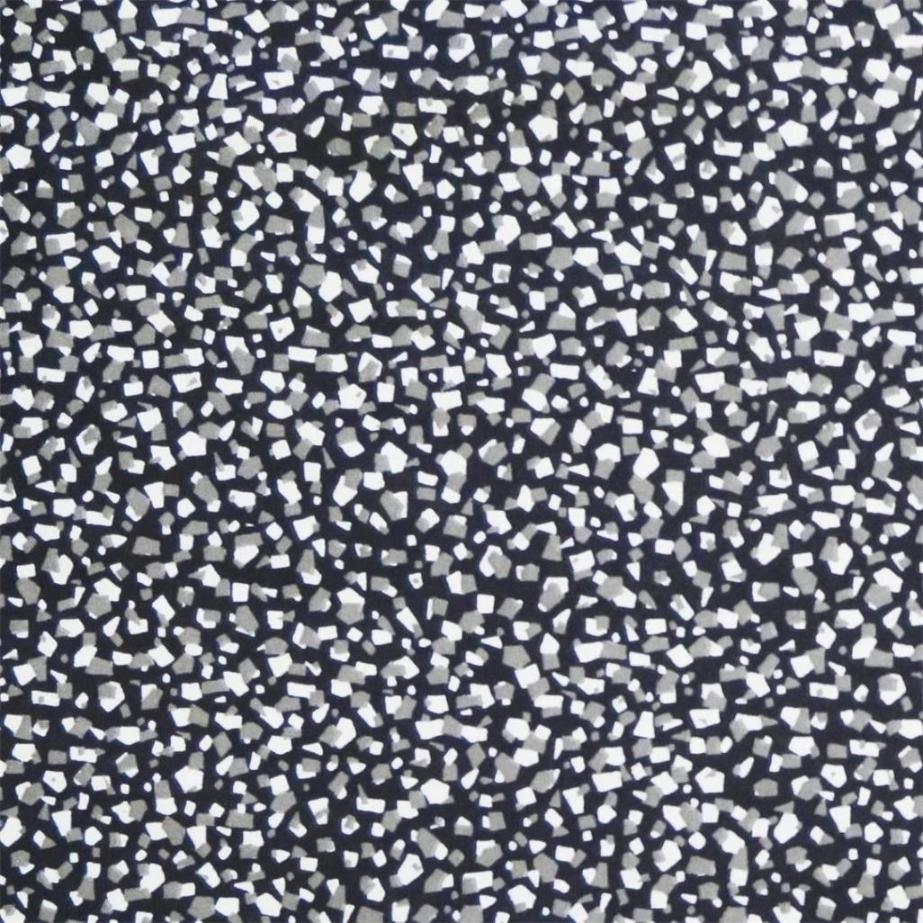 Assar en svart textilvaxduk med ett terazzomönster i vitt och grått på metervara i bredd 138 cm från Redlunds textil