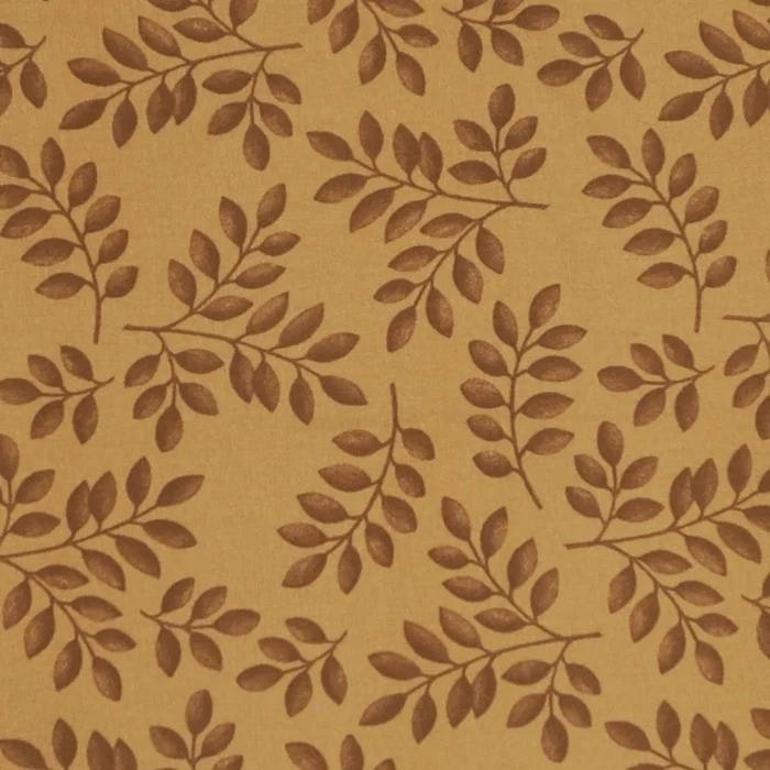 Kvistar en gulbrun textilvaxduk med ett bladmönster i brunt på metervara i bredd 138 cm från Redlunds textil
