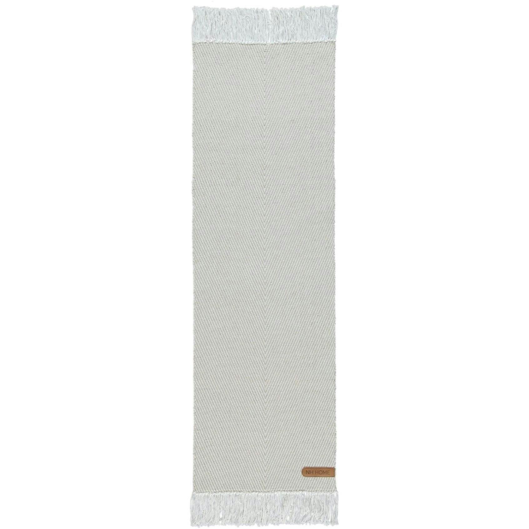 Noble house Tom long en beige och vit bordslöpare med med ett fiskbensmönster i mått 40 x 140 cm