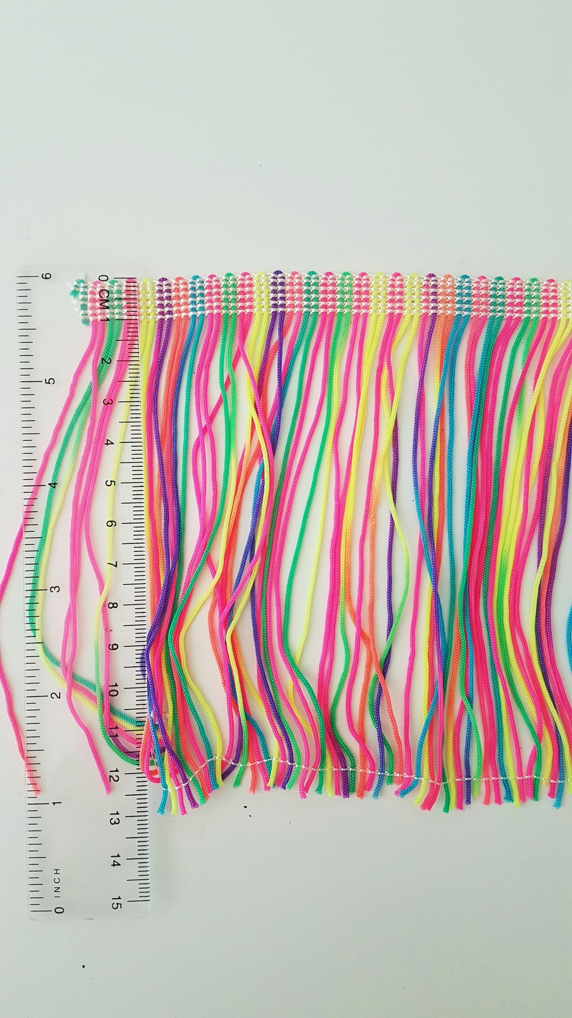 Bård med frans textil