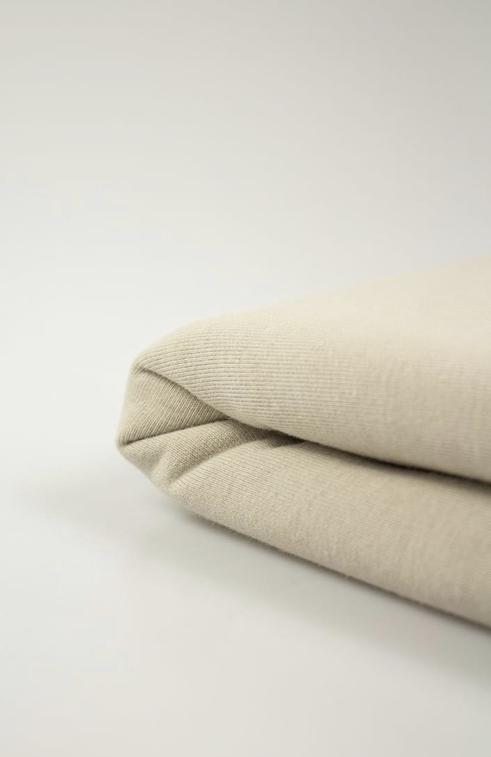 Tyg tyger outlet beige French Terry college flossad baksida