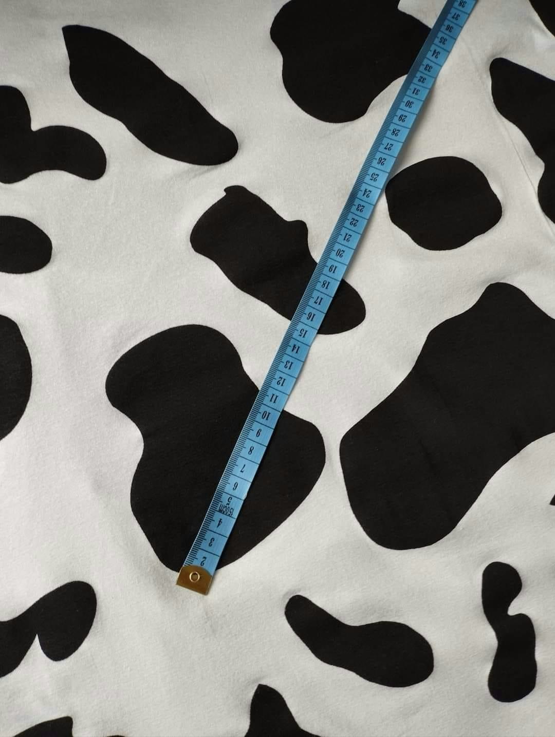 Tyg tyger Jersey trikå kosa svarta fläckar
