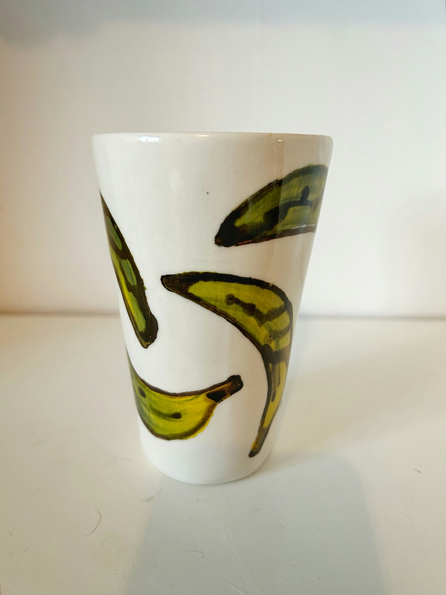 Hög kopp grön banan