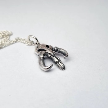 Mythosaur inspired scull silver pendant