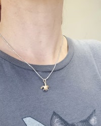 Havssköldpadda mini - hänge i 18K guld
