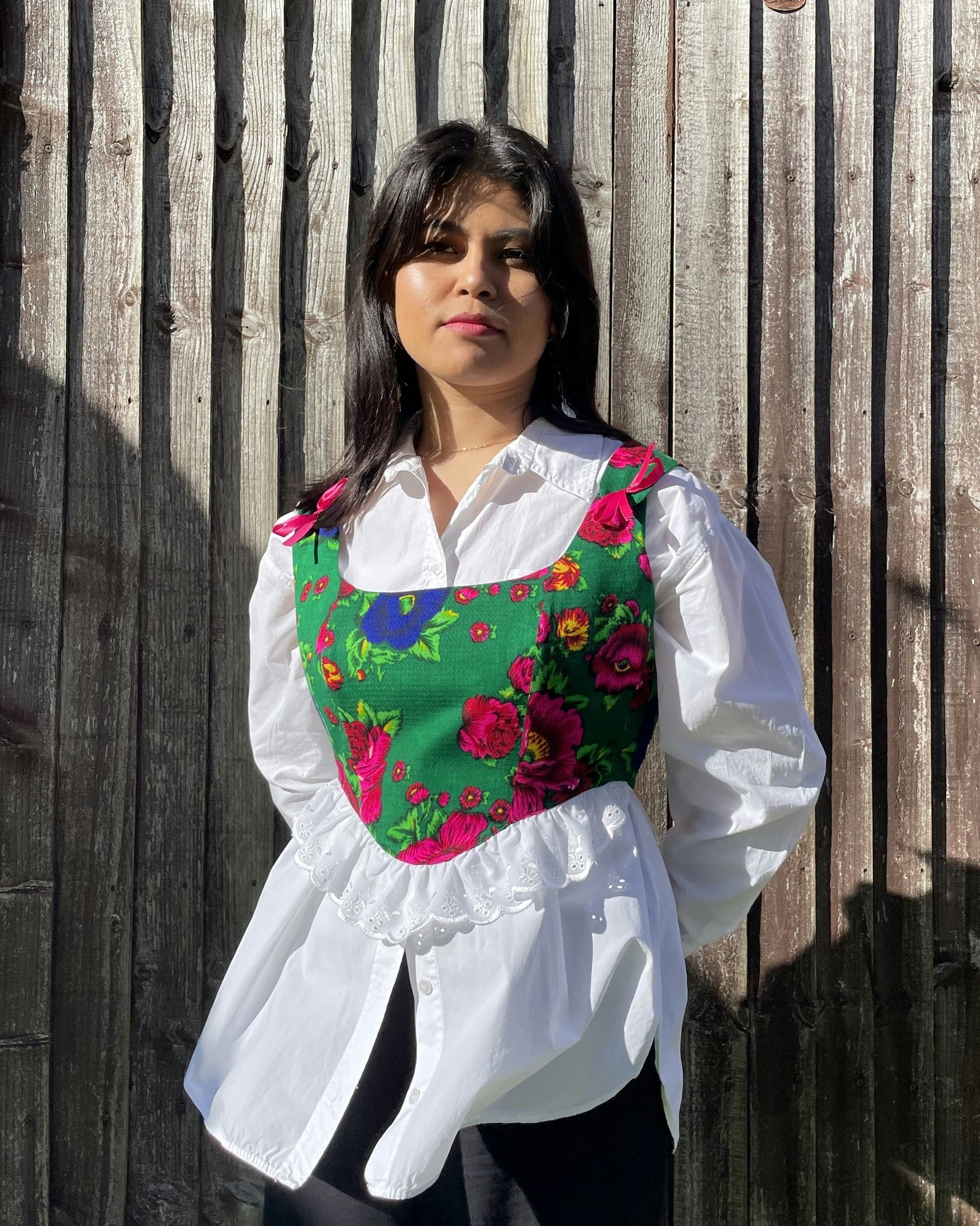Handmade corset top Laleh featuring gorgeous (Gulnigar) floral fabric with fully lined cotton with adjustable lace-up back with a pink bow on the shoulder straps.