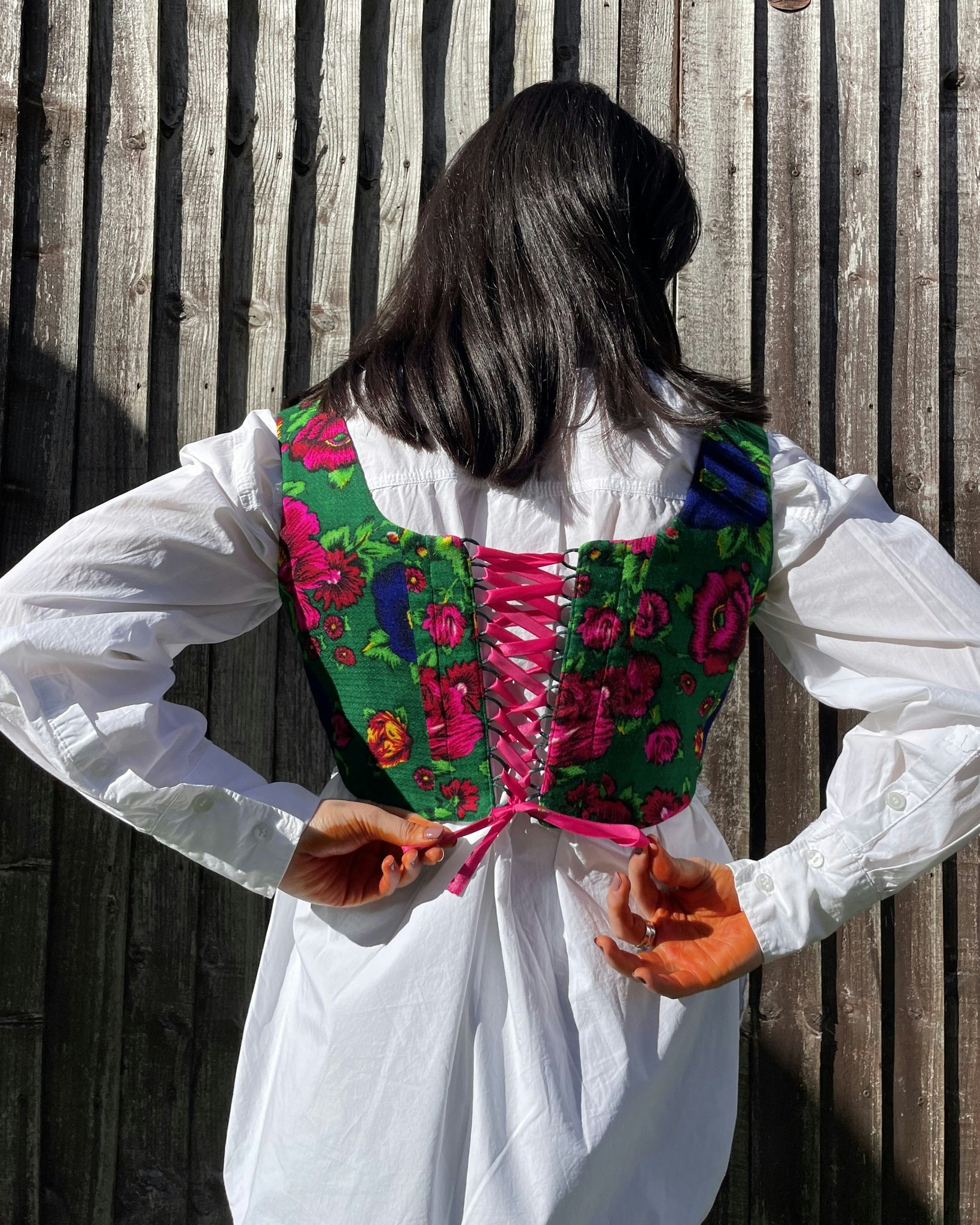 Handmade corset top Laleh featuring gorgeous (Gulnigar) floral fabric with fully lined cotton with adjustable lace-up back with a pink bow on the shoulder straps.