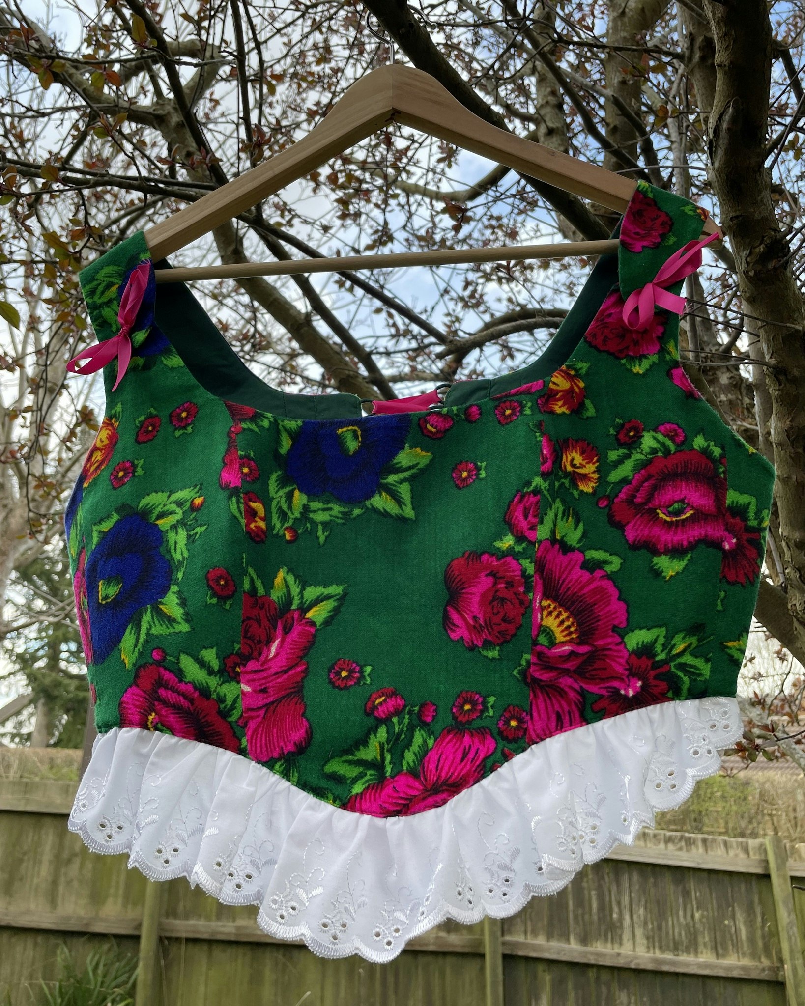 Handmade corset top Laleh featuring gorgeous (Gulnigar) floral fabric with fully lined cotton with adjustable lace-up back with a pink bow on the shoulder straps.