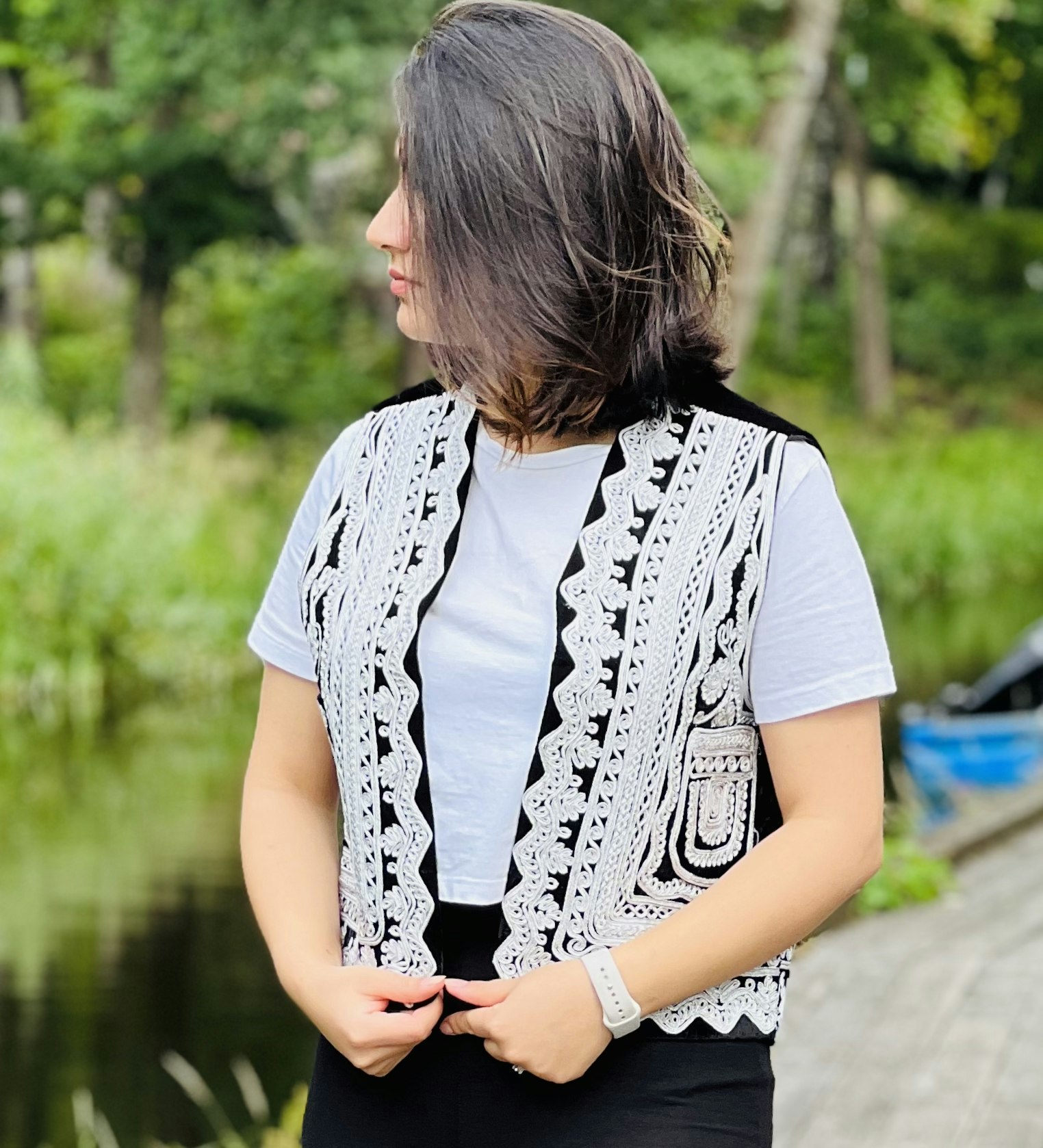 The vest is made from high-quality velvet fabric, decorated with intricate floral patterns & motifs. Hand-crafted using metallic silver threads & braid.