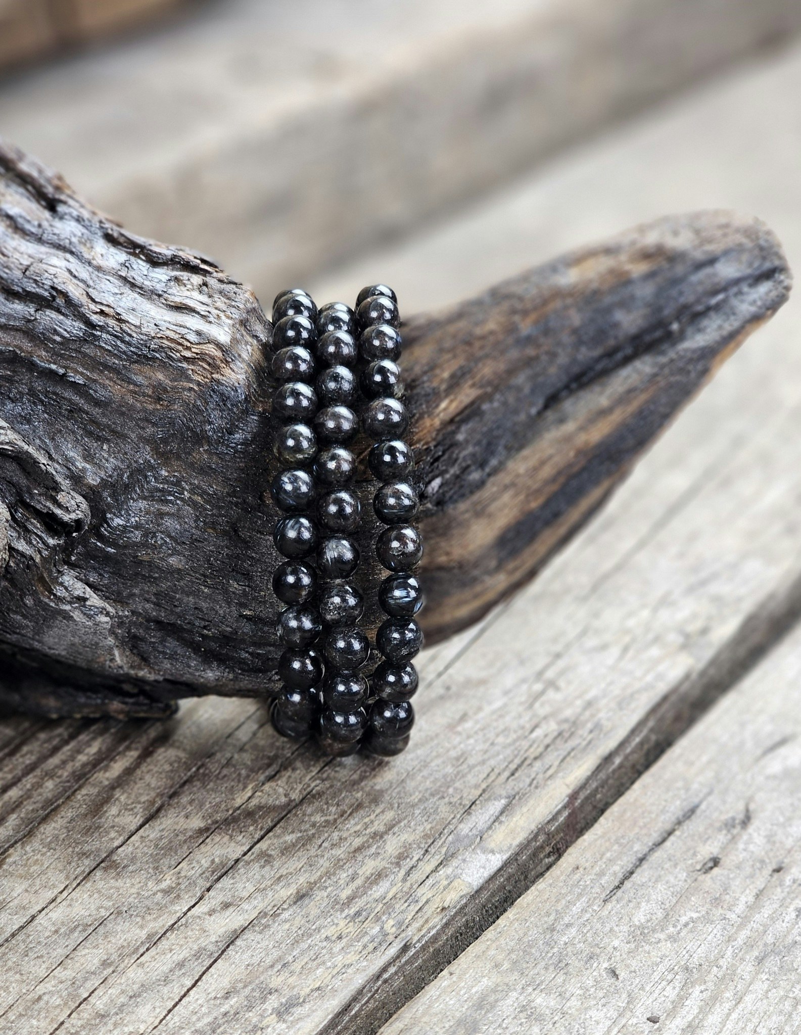 Astrofyllit, armband 6mm runda pärlor