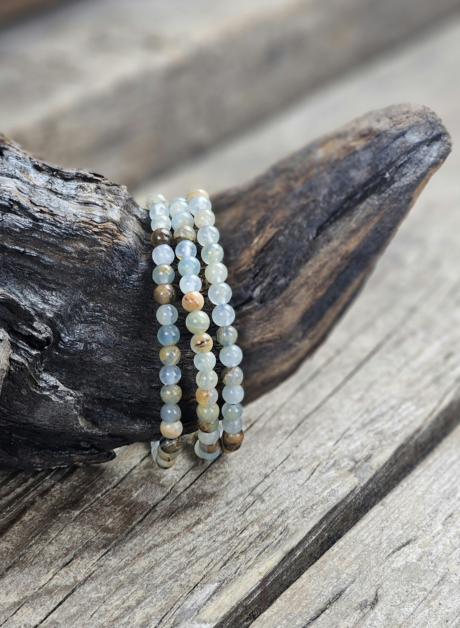 Blå/Brun Onyx, armband 5-6mm runda pärlor