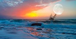 Old ship in stormy seas