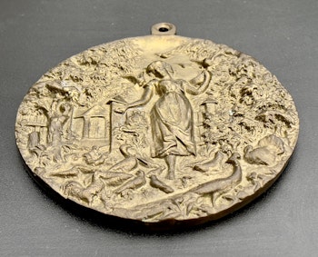Medalj av Zosia som matar fjäderfä 1885
