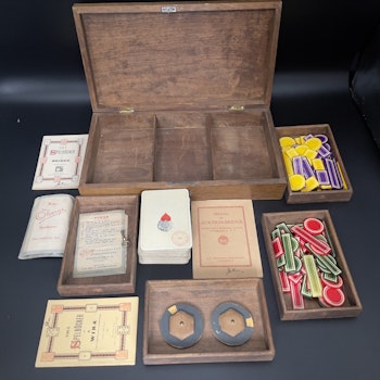 Antique playing card set and chips in wooden box